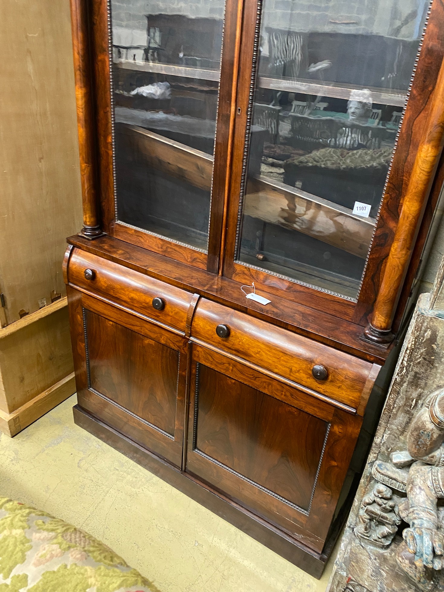 An early Victorian rosewood bookcase, width 127cm, height 190cm